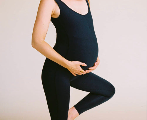 Pregnant woman wearing EMF shielding clothing